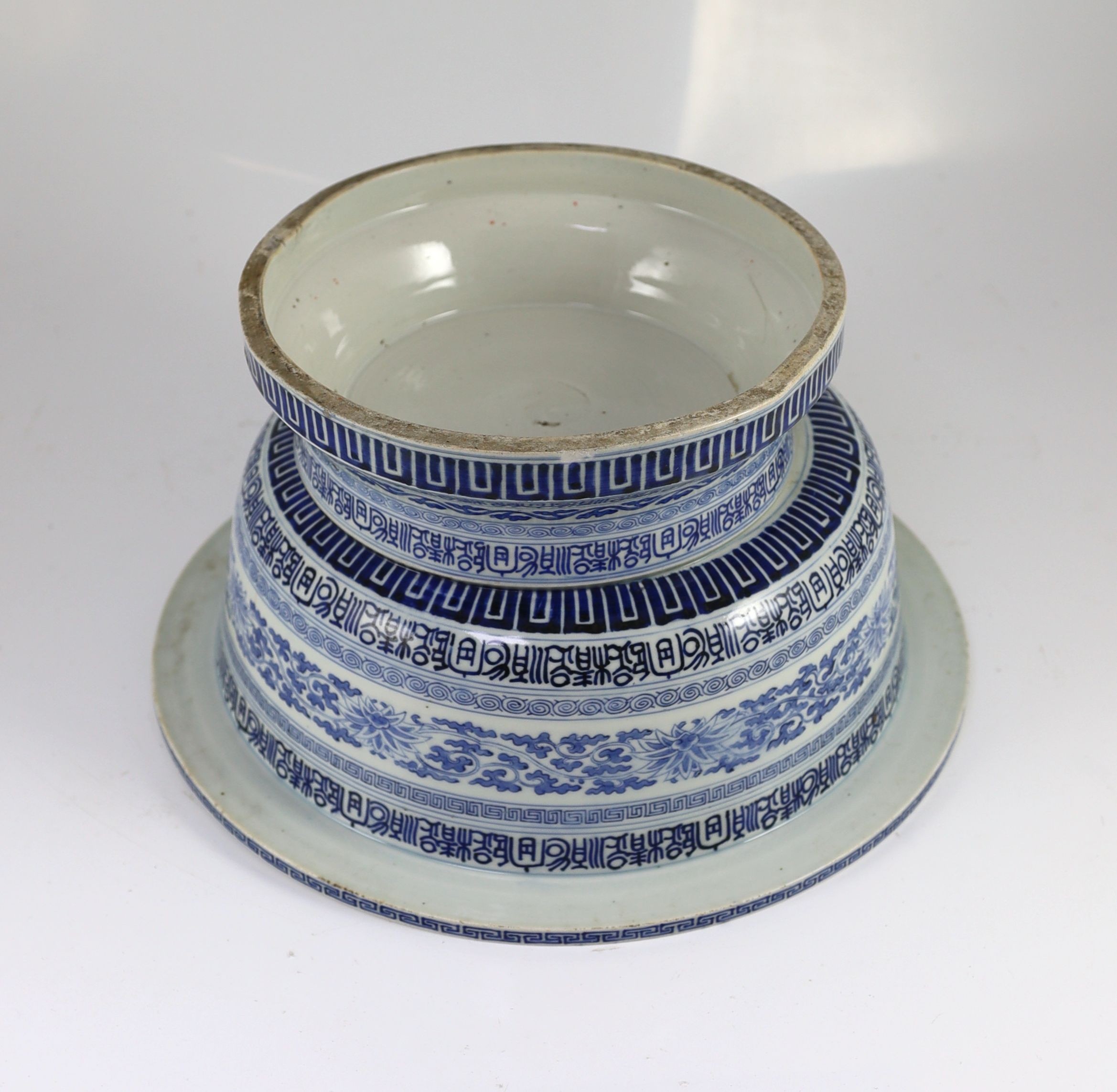 A unusual Chinese blue and white pedestal bowl or basin, 19th century, 34cm diameter, cracks
